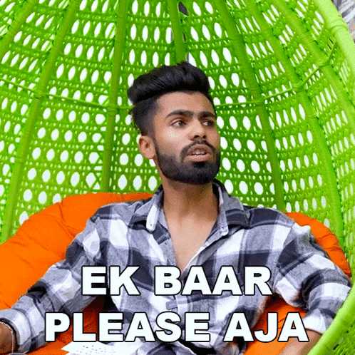 a man in a plaid shirt is sitting in a green chair with the words " ek baar please aja " above him