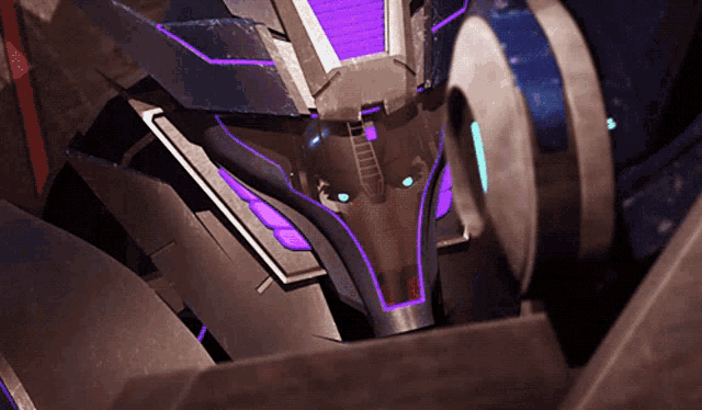 a close up of a robot with purple lights on its face
