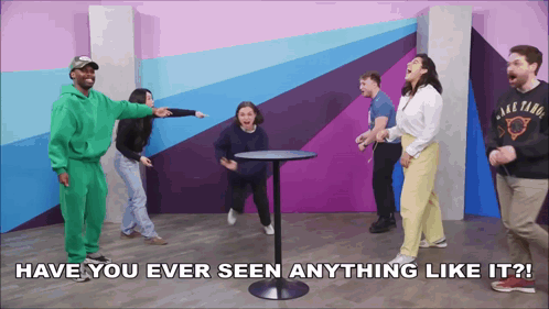 a group of people are standing around a table with the words have you ever seen anything like it