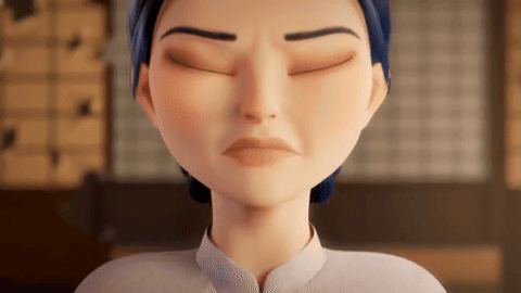 a close up of a cartoon character with her eyes closed and a sad look on her face .