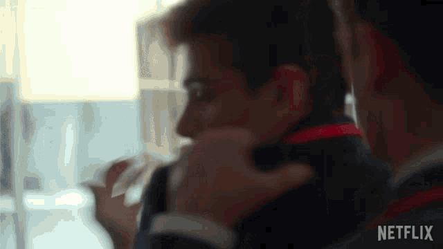 a close up of a man with a netflix logo on the bottom