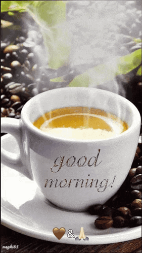 A steaming white coffee cup on a saucer reads “good morning!”