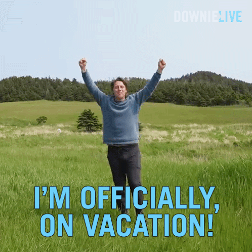 a man is standing in a field with his arms in the air and the words " i 'm officially on vacation "