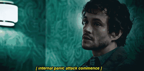 a man in a suit and tie is talking about an internal panic attack commence
