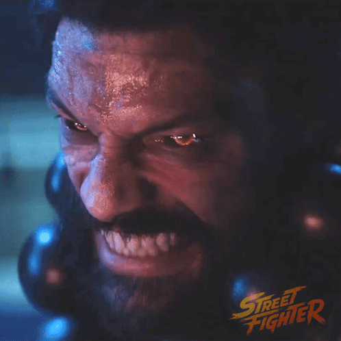 a close up of a man 's face with the word street fighter on the bottom right