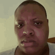 A man gives a stern, judging look directly at the camera.