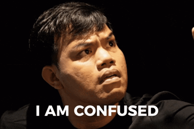 a man in a black shirt has the words i am confused on his face