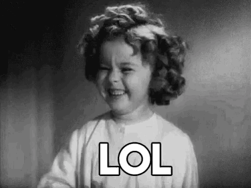 A young Shirley Temple laughs beneath a large “LOL” caption.