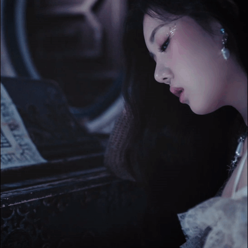 a close up of a woman 's face with the letter b visible