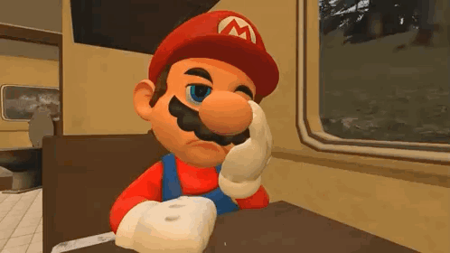 Mario sits by a train window looking bored and tired.