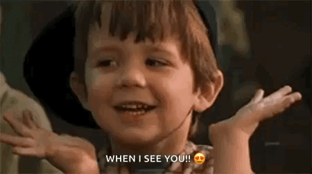 Spanky from The Little Rascals shrugs with a cheerful grin.