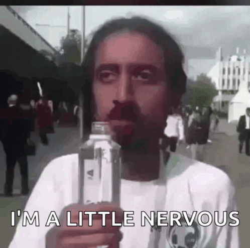A person looks uneasy in a street scene beneath “I'M A LITTLE NERVOUS.”
