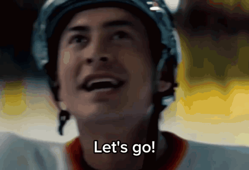 a hockey player says let 's go while wearing his helmet