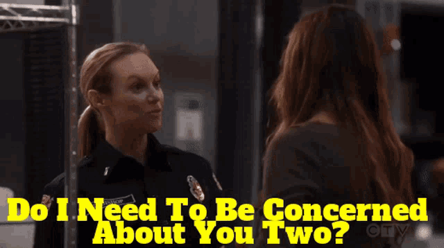 a woman is talking to another woman with the words do i need to be concerned about you two