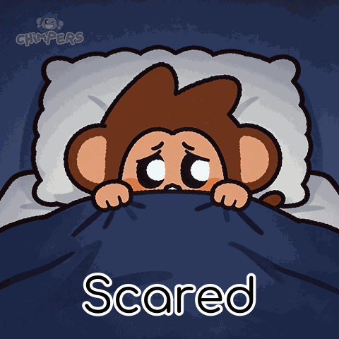 A cartoon monkey hides beneath a blanket with “Scared” text.