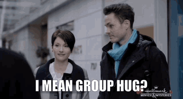 a man and a woman standing next to each other with the words i mean group hug on the bottom