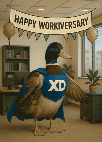 a duck in a blue cape with the letter x on it