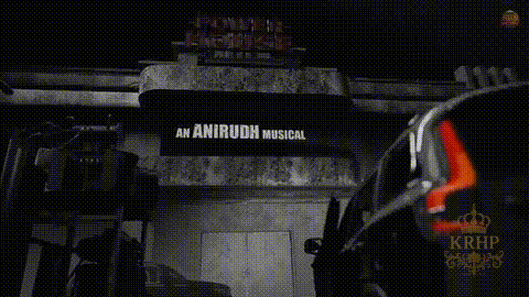 a black and white photo of a building with a sign that says an anirudh musical