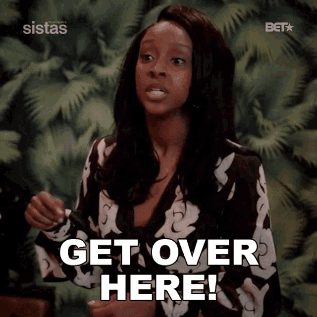a woman says get over here in front of a tropical background