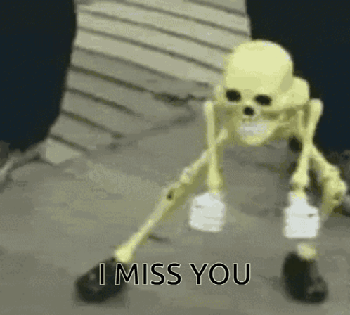 a skeleton with a bandage on its leg is standing on the ground and says i miss you .