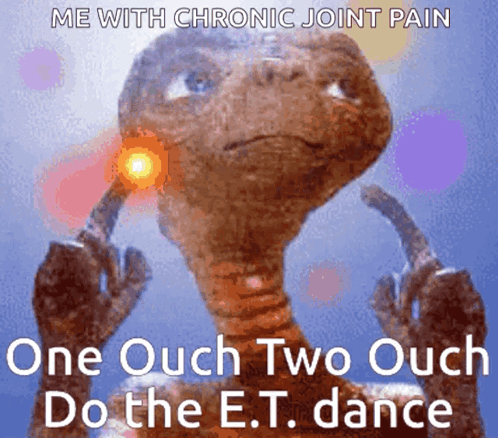 A small alien-like character dances with glowing orange hands as text reads “One Ouch Two Ouch Do the E.T. dance.”