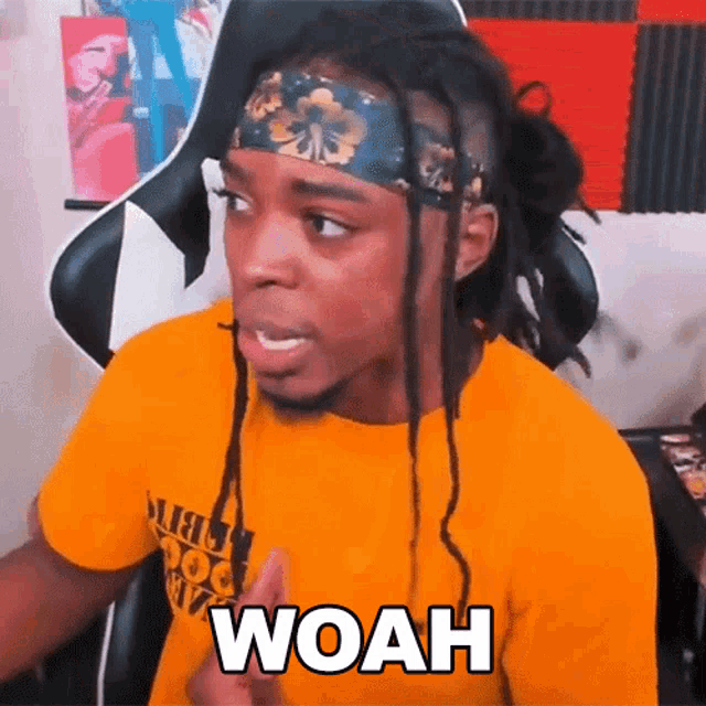 a man with dreadlocks wearing a headband and a yellow shirt says woah