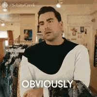 A man says “OBVIOUSLY” in a store-like setting.