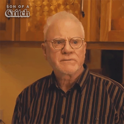 An older man looks worried in a TV scene, matching a starving reaction.