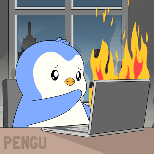 a penguin is sitting in front of a laptop with flames coming out of the screen