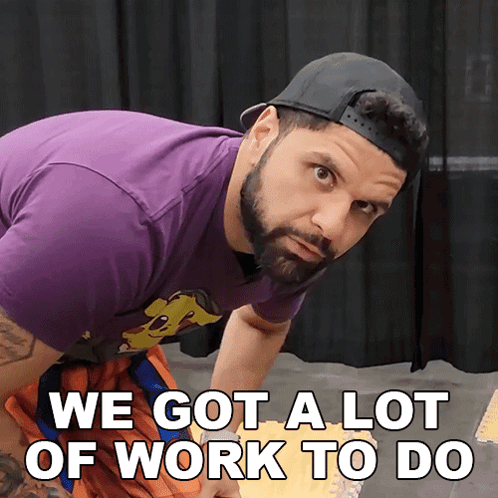 a man with a beard wearing a baseball cap and a purple shirt says we got a lot of work to do