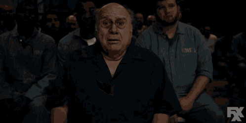 a man says " i don 't get it " in front of a crowd of people