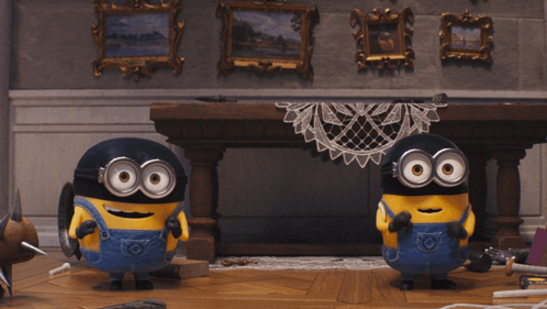 Two Minions stand on a stage in a Despicable Me scene.