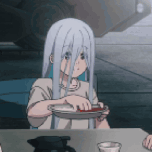 a girl with white hair is sitting at a table holding a plate of food .