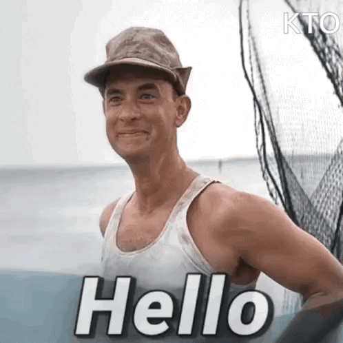A man smiles with a large “Hello” caption.