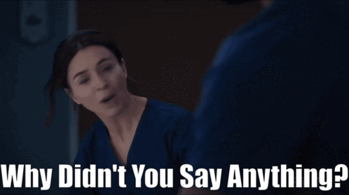 a woman in a blue scrub is talking to a man and the words why didn 't you say anything