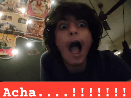 a man with a surprised look on his face is behind a sign that says " acha "