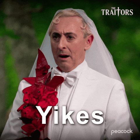 a man in a bride 's veil with the word yikes on the bottom right