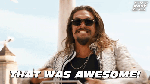 Jason Momoa as Dante smiles in sunglasses as the caption says, “THAT WAS AWESOME!”