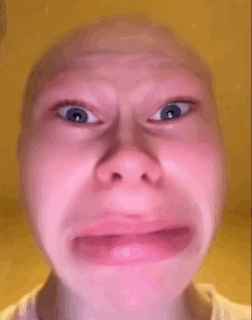 A close-up face makes an exaggerated terrified crying expression.