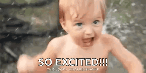 A wet baby splashes in water with the caption “SO EXCITED!!!”