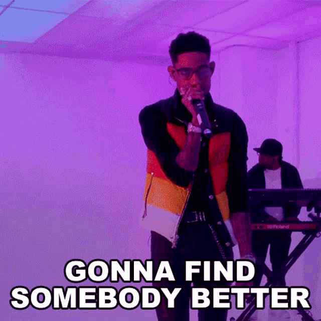a man is singing into a microphone with the words `` gonna find somebody better '' above him .