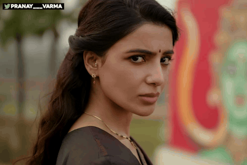 A woman gives a displeased sideways glance.