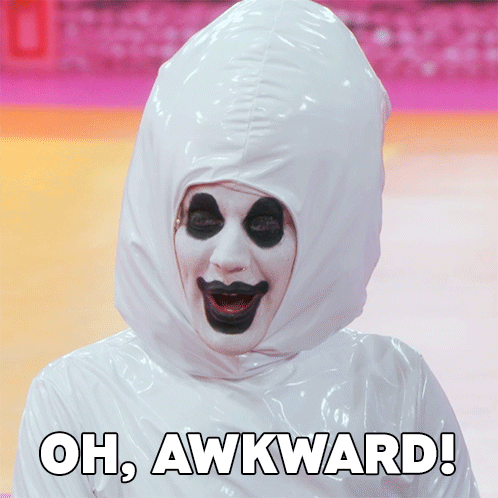 A drag performer with pale makeup reacts beneath the caption “OH, AWKWARD!”