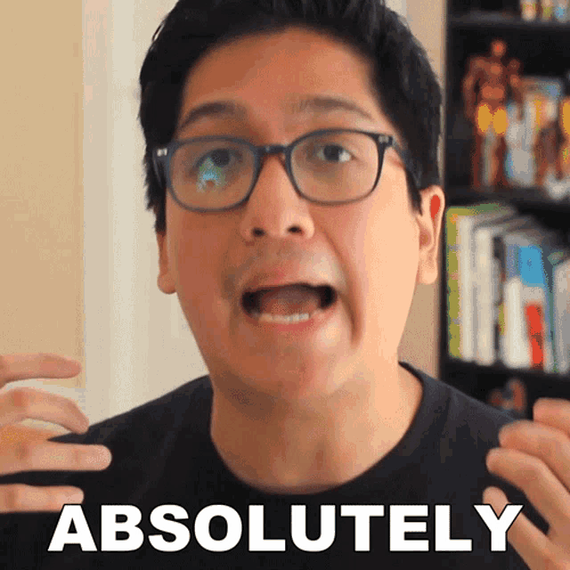 a man wearing glasses and a black shirt says " absolutely "