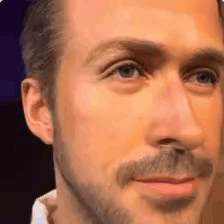a close up of a man 's face with a beard and a white shirt .