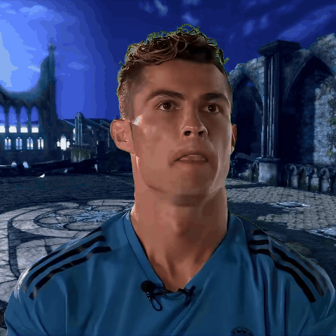 a man wearing a blue shirt with the word real on the front