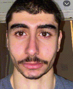 a close up of a man 's face with an arrow pointing to the left