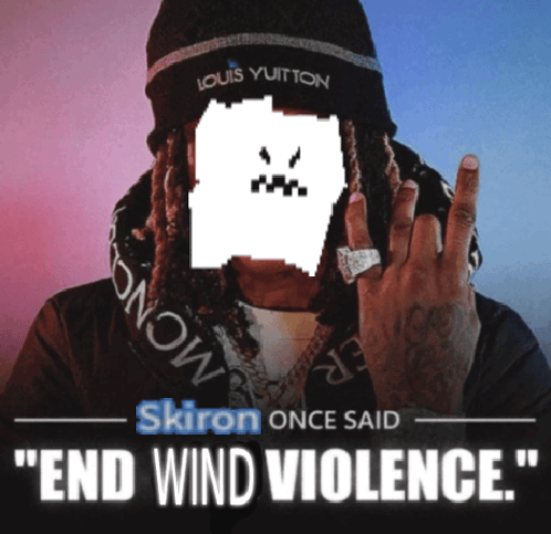 a man wearing a louis vuitton beanie holds up his fingers
