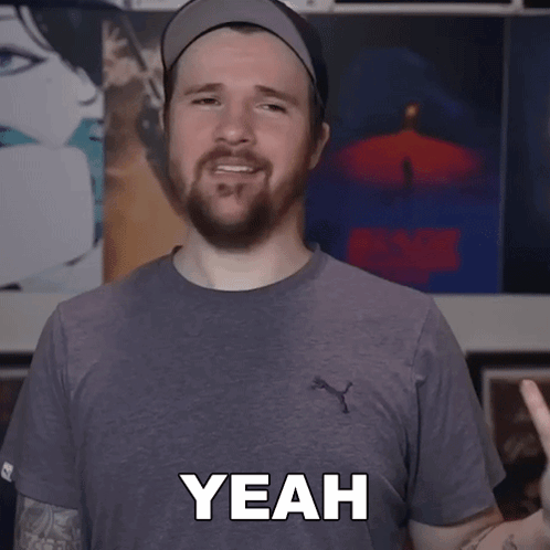 a man with a beard is wearing a puma shirt and saying yeah