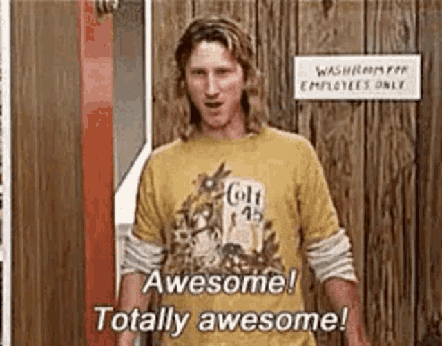 A man in a wood-paneled room says, “Awesome! Totally awesome!”